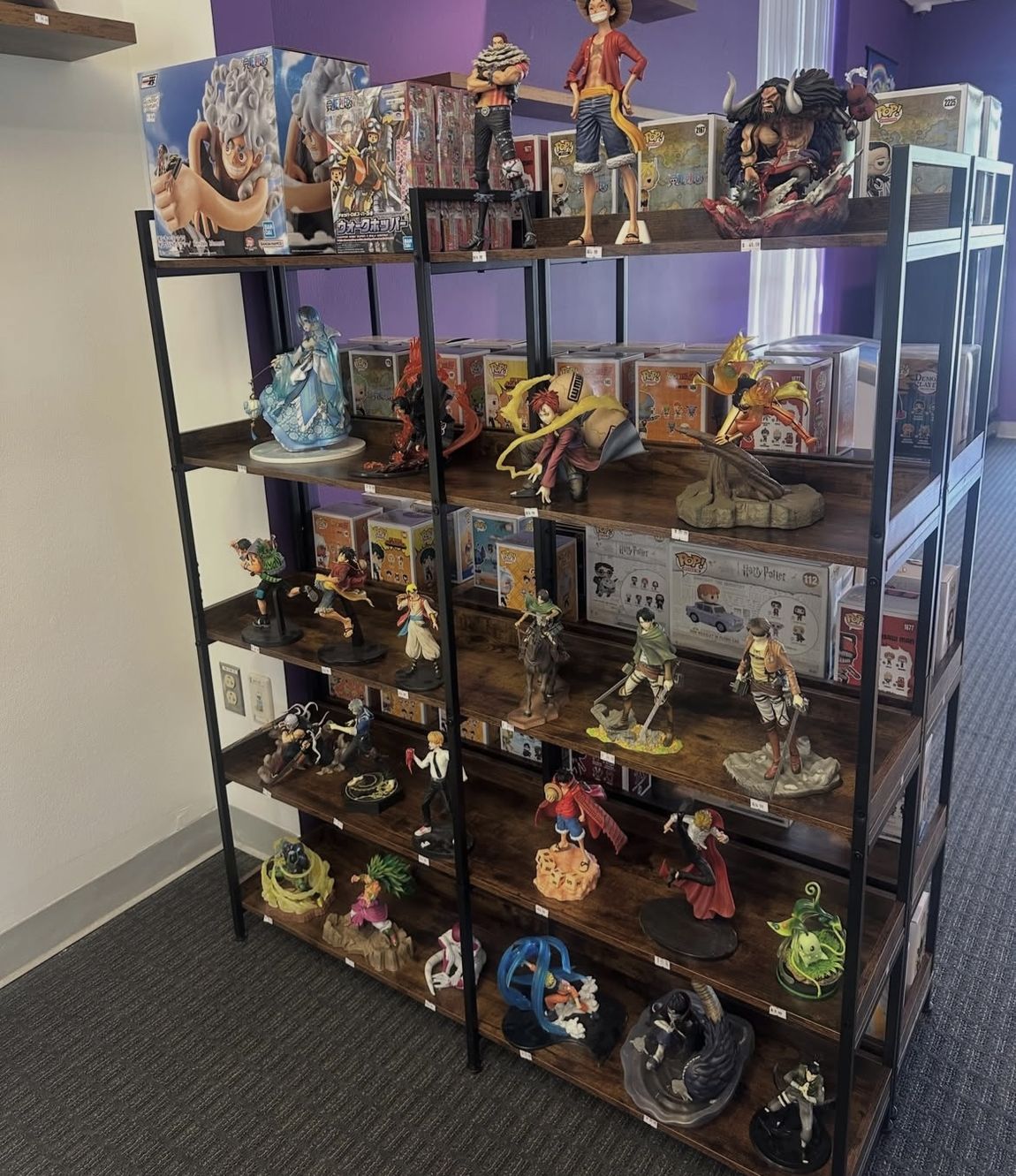 Wall of anime figures and Funko Pops